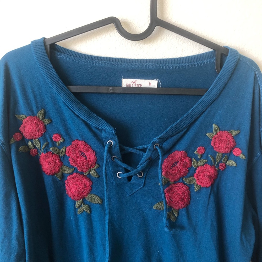 blue top with rose embroidery